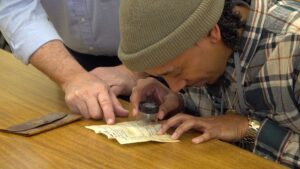 aaron-examines-the-document-699f78708134d