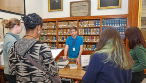 American Ancestors' Library Services Coordinator Aidan Walsh introduces teachers to the nonprofit's research library collections during a professional development program in Boston, image by Claire Vail Photography.