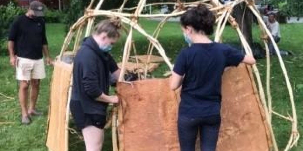 Students constructing wigwam in Skowhegan
